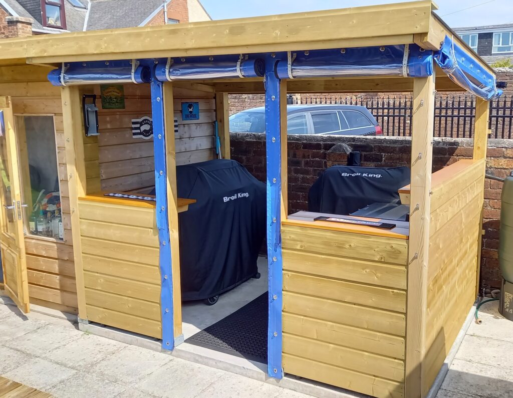 Blue PVC Side Panels Rolled Up on Wooden Garden Shed